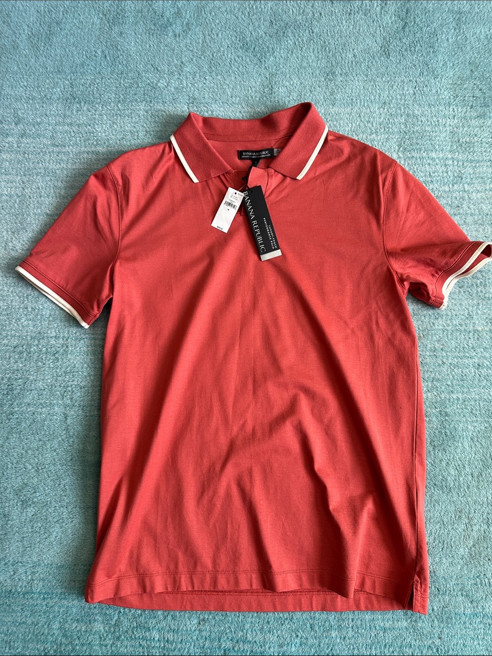 Banana Republic Men’s Coral Polo with White Trim . Luxury touch performance med